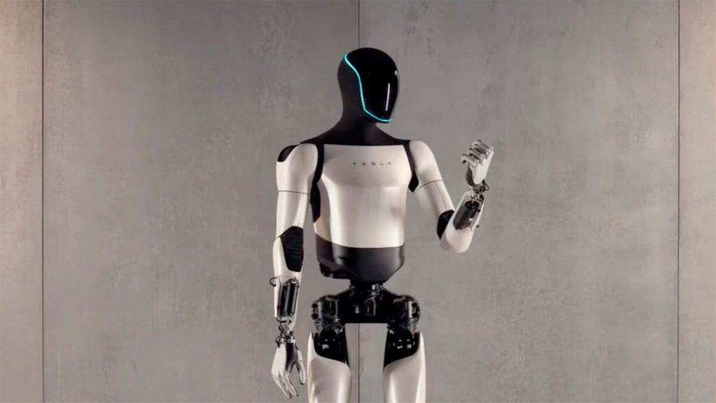 Robô da Tesla com mão fechada e olhando para o lado