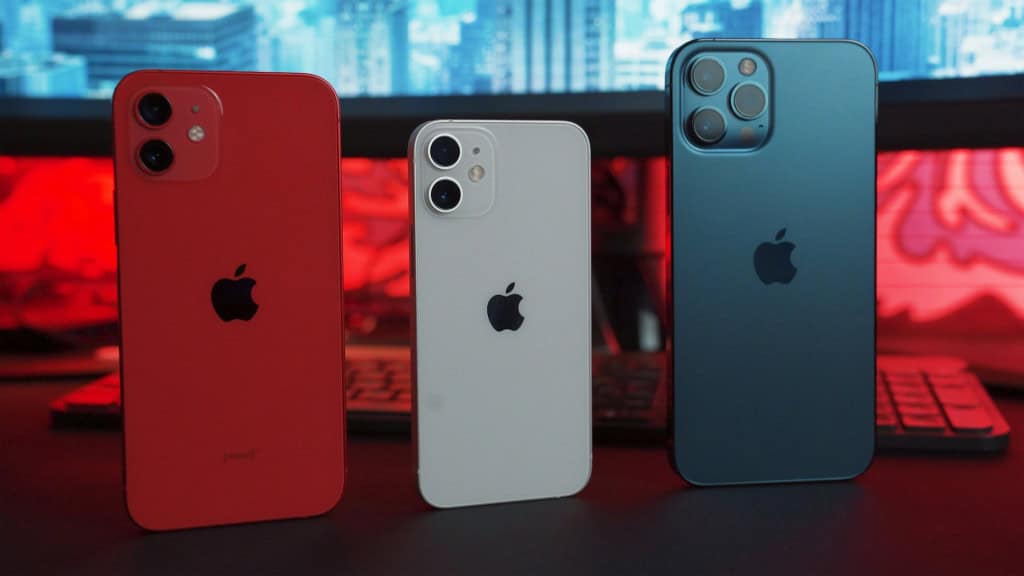 Três modelos de iPhone, nas cores vermelho, branco e chumbo