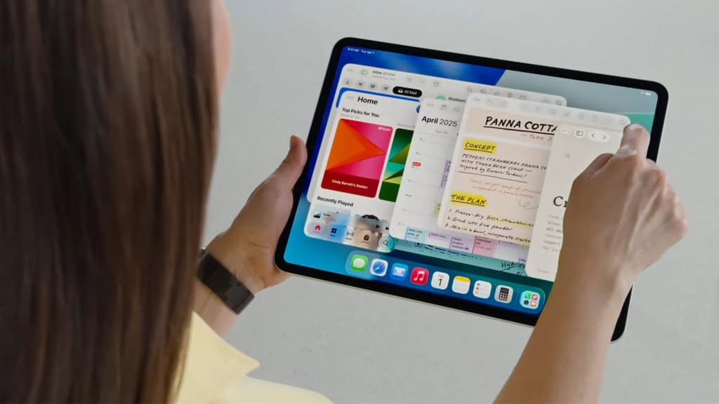 Mulher redimensionando janelas num iPad com iPadOS 26